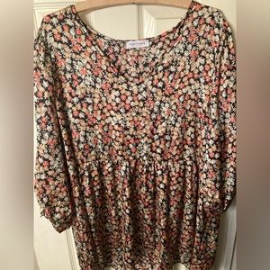 Brand new loose fitting shirt. Dress up with nice slacks or down with jeans.